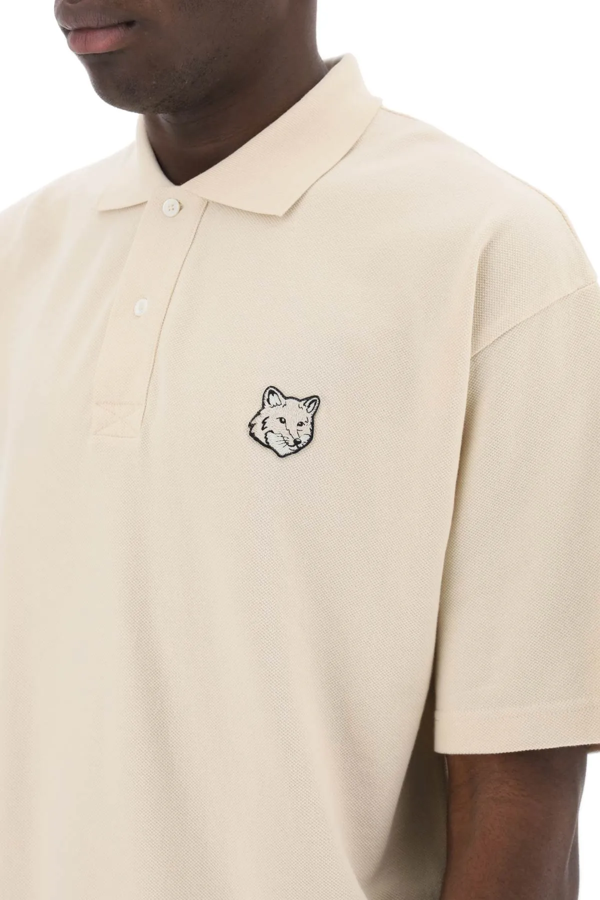 "oversized polo shirt with bold fox